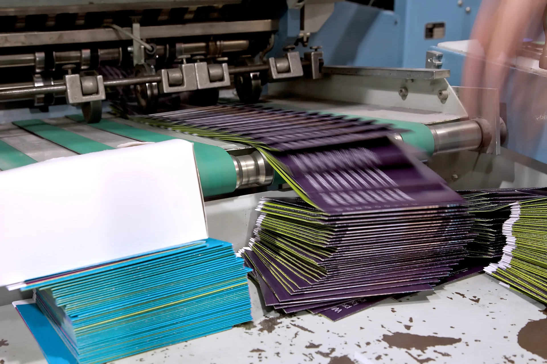 Industrial folding machine processing brochures in print production