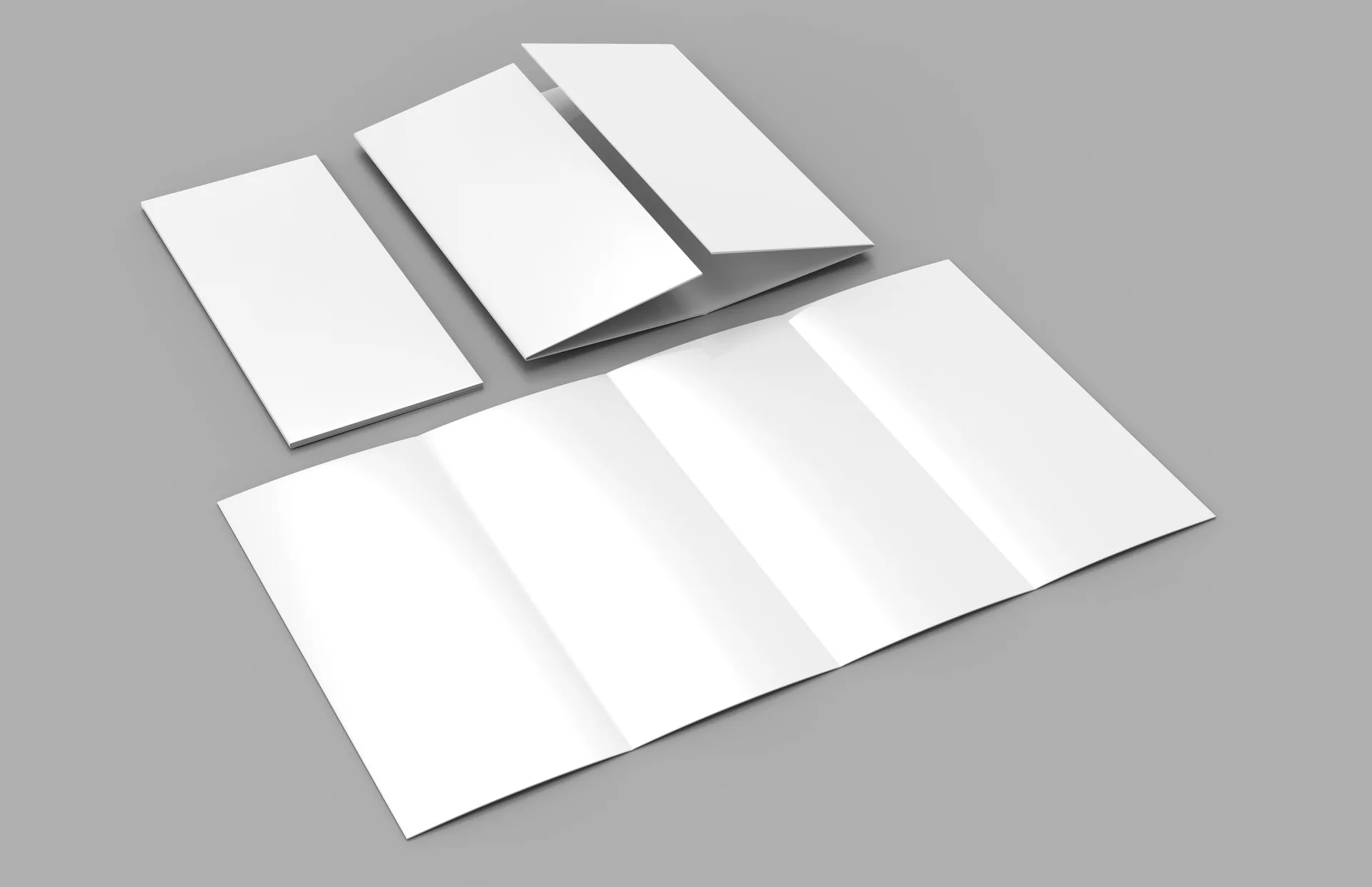 Folded brochure mockups showing design concepts arranged for client review
