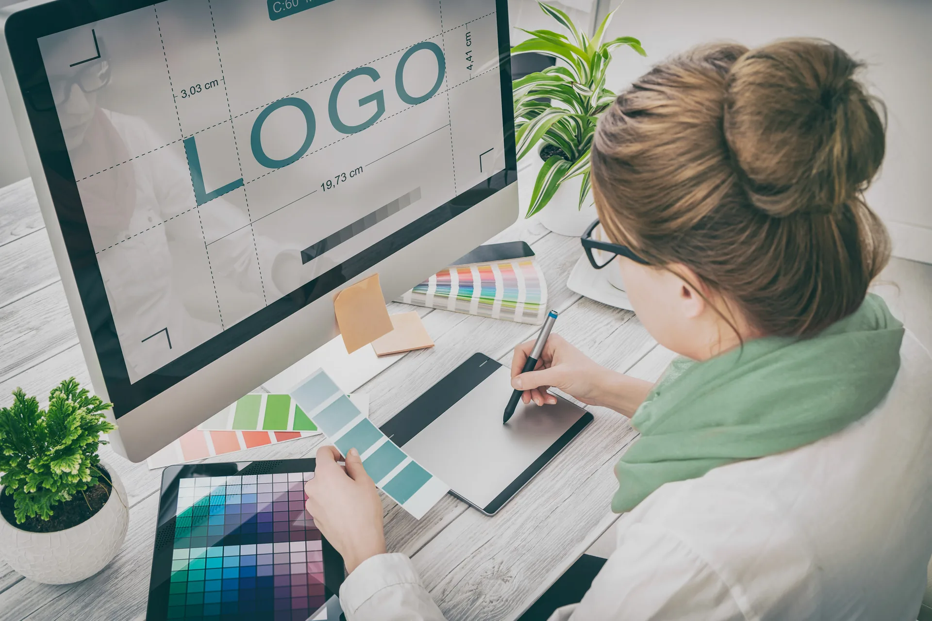 Graphic designer reviewing brand color samples in studio