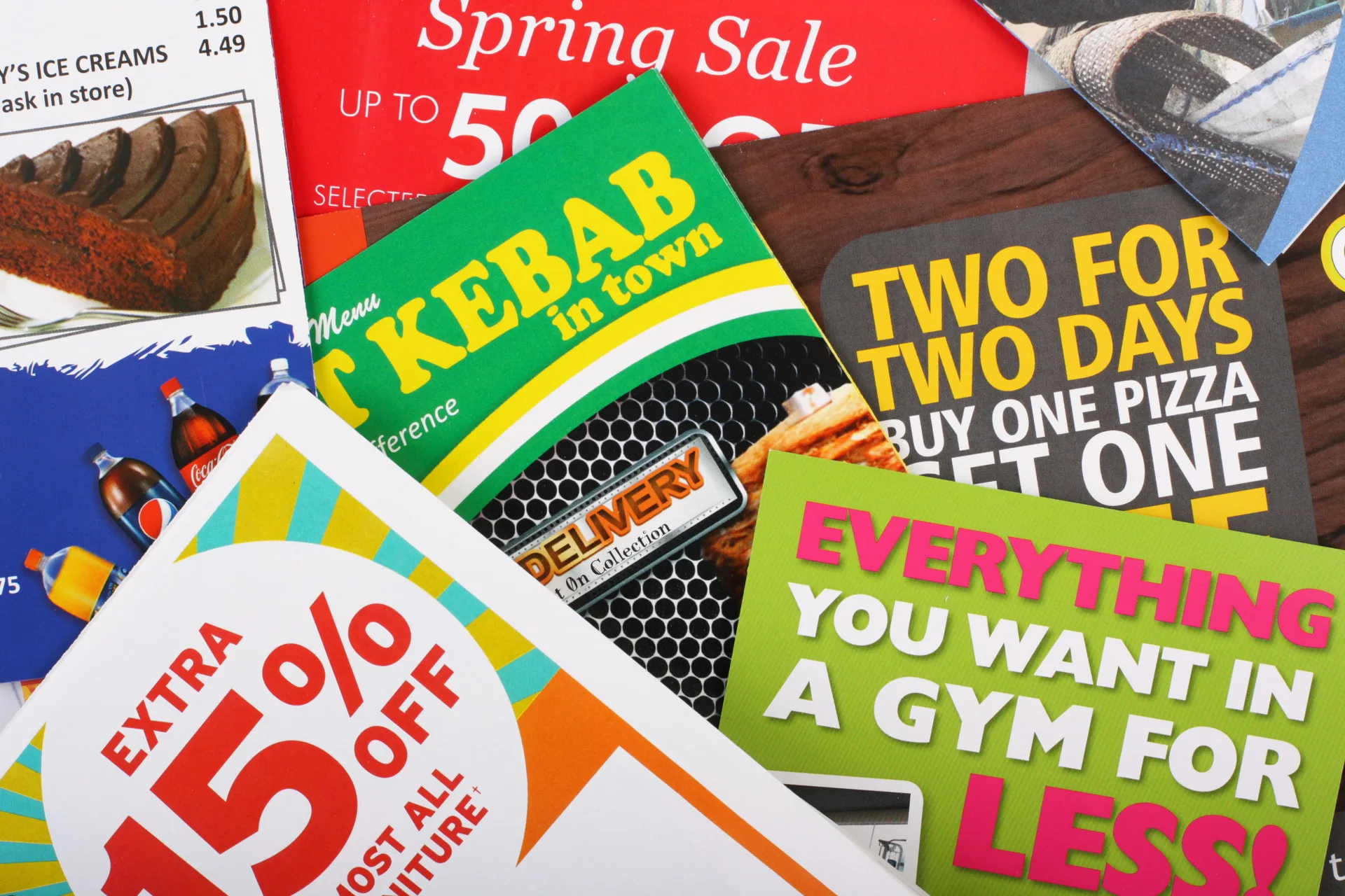 Stack of printed promotional postcards and flyers